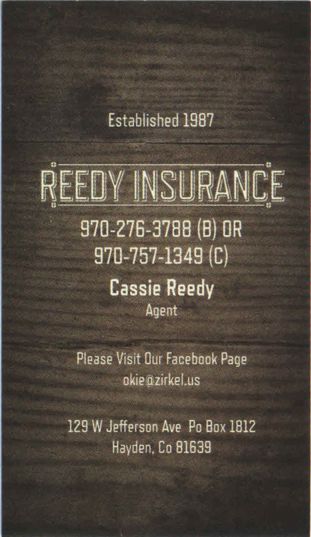 A wooden sign advertising reedy insurance.